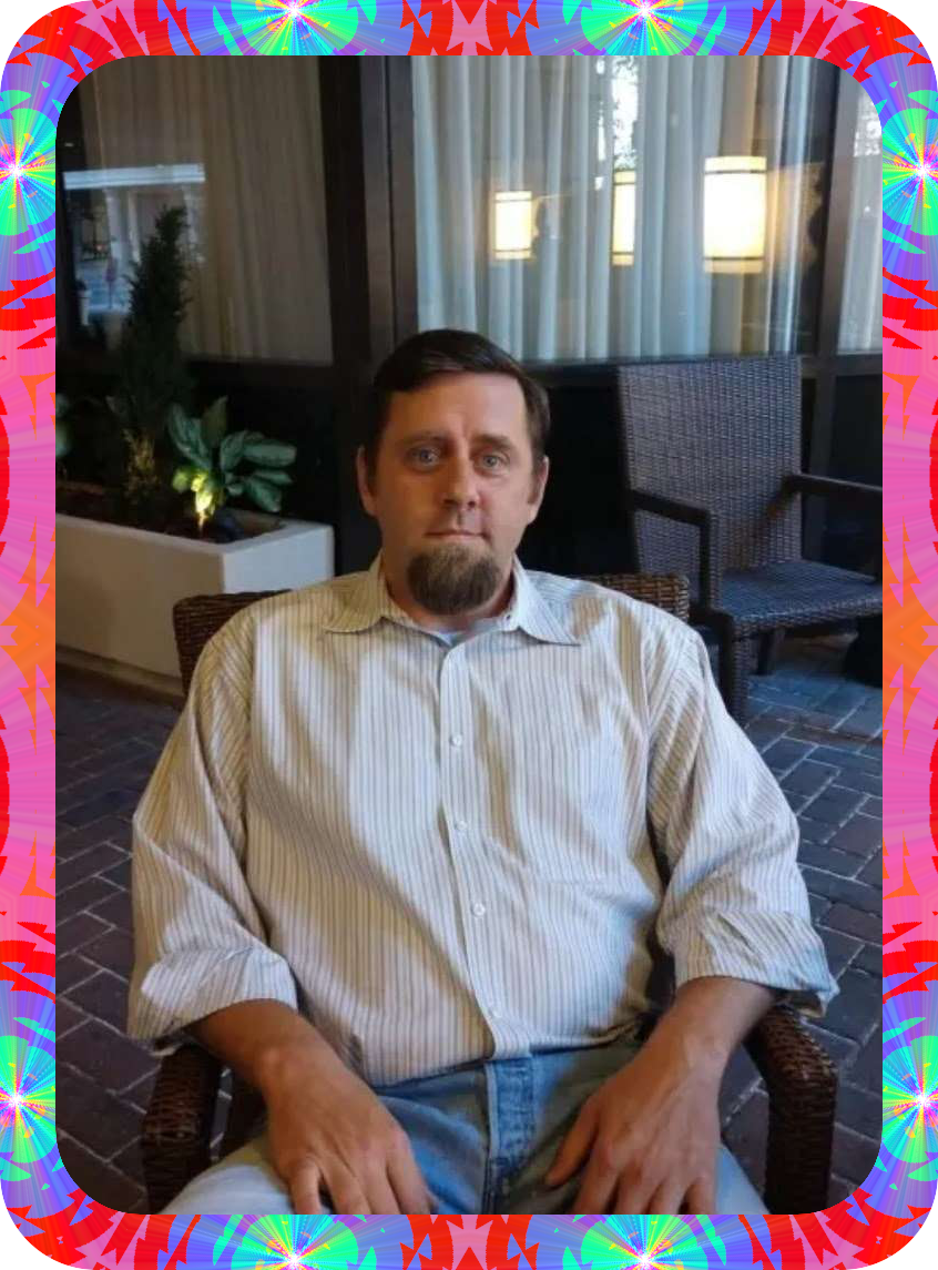 A picture of Carl Buck in a psychedelic frame.